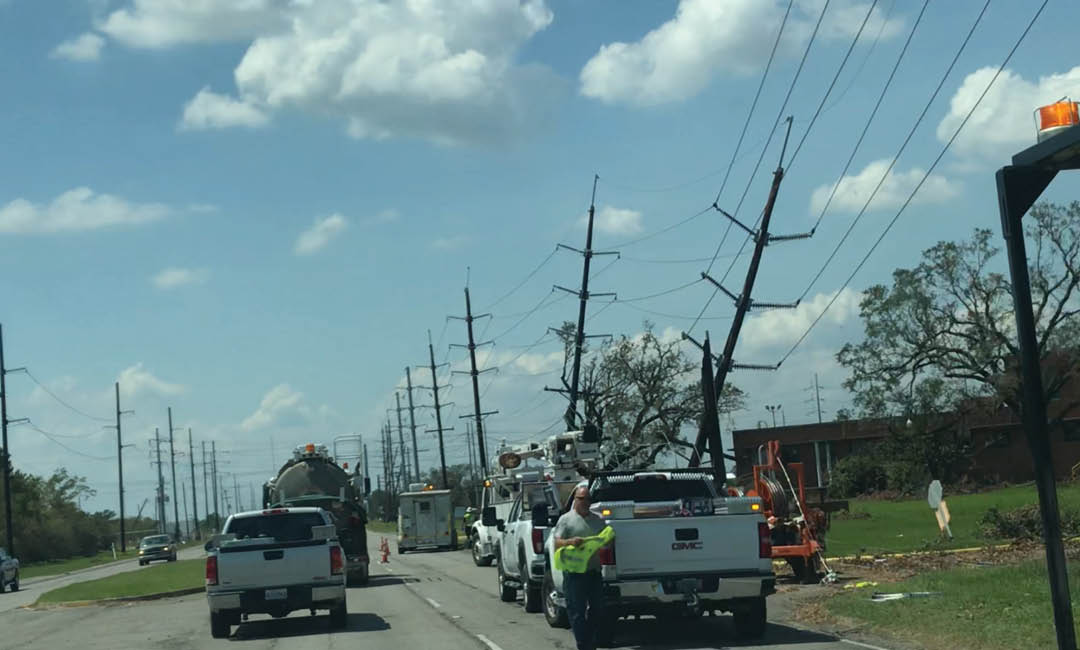 valiant linemen working on down power lines on roadside